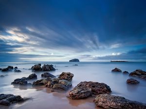 Preview wallpaper stones, sand, sea, beams, sky