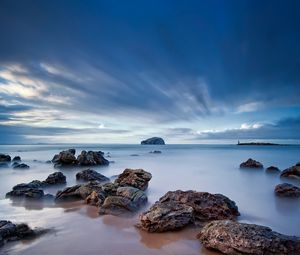 Preview wallpaper stones, sand, sea, beams, sky