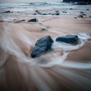 Preview wallpaper stones, sand, waves, shore, sea, landscape