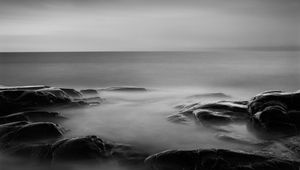 Preview wallpaper stones, sea, dark, horizon, nature