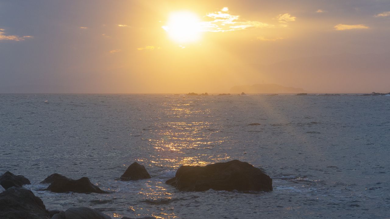 Wallpaper stones, sea, glare, sunset