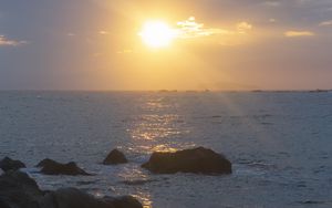 Preview wallpaper stones, sea, glare, sunset