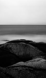 Preview wallpaper stones, sea, horizon, black and white, nature