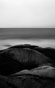 Preview wallpaper stones, sea, horizon, black and white, nature