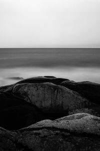 Preview wallpaper stones, sea, horizon, black and white, nature