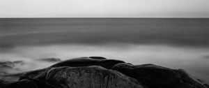 Preview wallpaper stones, sea, horizon, black and white, nature