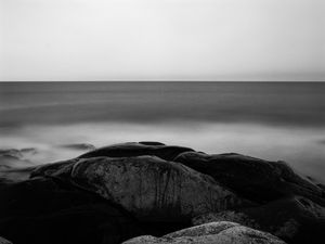 Preview wallpaper stones, sea, horizon, black and white, nature