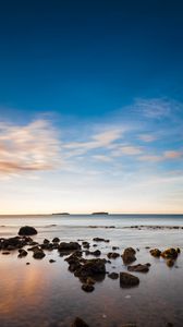 Preview wallpaper stones, sea, horizon, sky, clouds