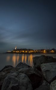 Preview wallpaper stones, sea, lighthouse, houses, lights