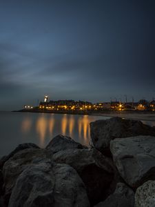 Preview wallpaper stones, sea, lighthouse, houses, lights