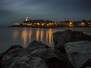 Preview wallpaper stones, sea, lighthouse, houses, lights