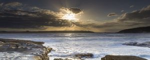 Preview wallpaper stones, sea, rays, horizon