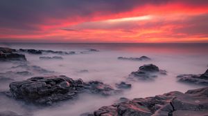 Preview wallpaper stones, sea, sunset, horizon, coast