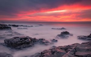 Preview wallpaper stones, sea, sunset, horizon, coast