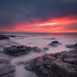 Preview wallpaper stones, sea, sunset, horizon, coast
