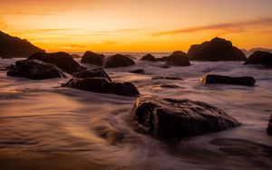 Preview wallpaper stones, sea, sunset, coast, sky