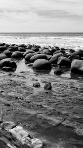 Preview wallpaper stones, sea, water, beach, horizon, bw