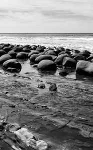 Preview wallpaper stones, sea, water, beach, horizon, bw