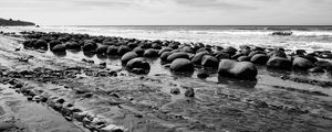 Preview wallpaper stones, sea, water, beach, horizon, bw
