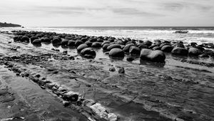 Preview wallpaper stones, sea, water, beach, horizon, bw