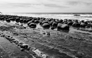 Preview wallpaper stones, sea, water, beach, horizon, bw
