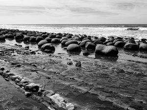 Preview wallpaper stones, sea, water, beach, horizon, bw