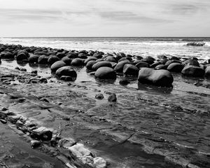 Preview wallpaper stones, sea, water, beach, horizon, bw