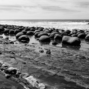 Preview wallpaper stones, sea, water, beach, horizon, bw