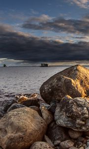 Preview wallpaper stones, sea, water, boat, horizon