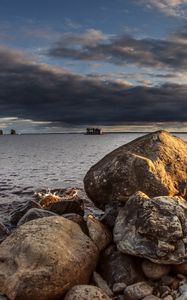 Preview wallpaper stones, sea, water, boat, horizon