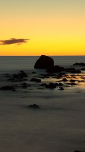 Preview wallpaper stones, sea, water, horizon, sunset