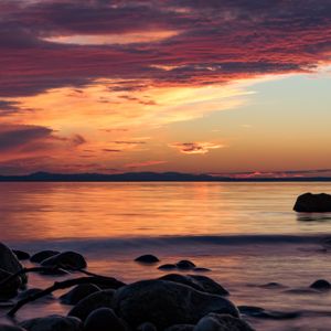 Preview wallpaper stones, sea, wave, clouds, sunset, nature