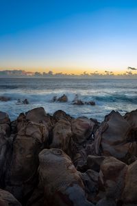 Preview wallpaper stones, sea, waves, horizon, nature, sunset