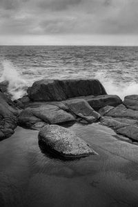 Preview wallpaper stones, shore, sea, waves, splashes, black and white