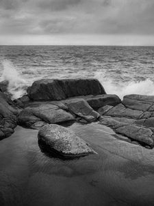 Preview wallpaper stones, shore, sea, waves, splashes, black and white