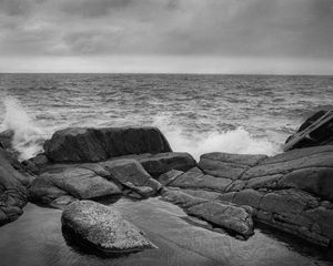 Preview wallpaper stones, shore, sea, waves, splashes, black and white