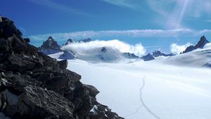 Preview wallpaper stones, snow, mountains, sky, sun, avalanche