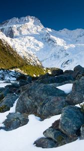 Preview wallpaper stones, snow, mountains, thawed patches, spring, light