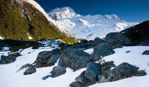 Preview wallpaper stones, snow, mountains, thawed patches, spring, light