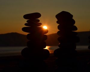 Preview wallpaper stones, stack, sun, sunset, dark