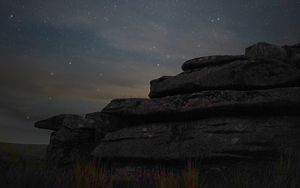 Preview wallpaper stones, starry sky, grass, nature, dark
