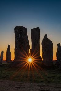 Preview wallpaper stones, stonehenge, sun, sunset