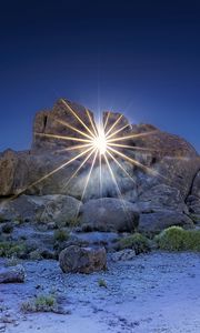 Preview wallpaper stones, sun, rays, nature, landscape