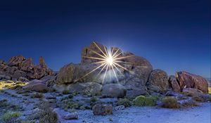 Preview wallpaper stones, sun, rays, nature, landscape
