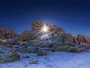 Preview wallpaper stones, sun, rays, nature, landscape