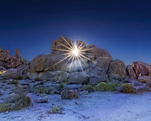 Preview wallpaper stones, sun, rays, nature, landscape