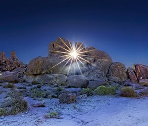 Preview wallpaper stones, sun, rays, nature, landscape