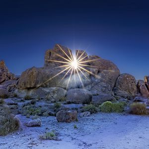 Preview wallpaper stones, sun, rays, nature, landscape