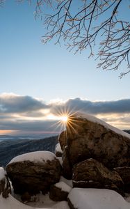Preview wallpaper stones, sun, snow, winter, branches, nature