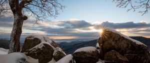 Preview wallpaper stones, sun, snow, winter, branches, nature